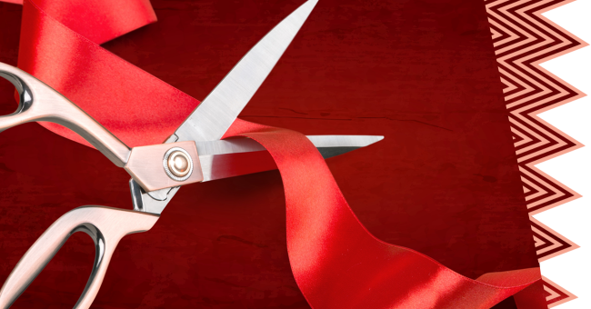 Ciseau qui coupe un ruban rouge